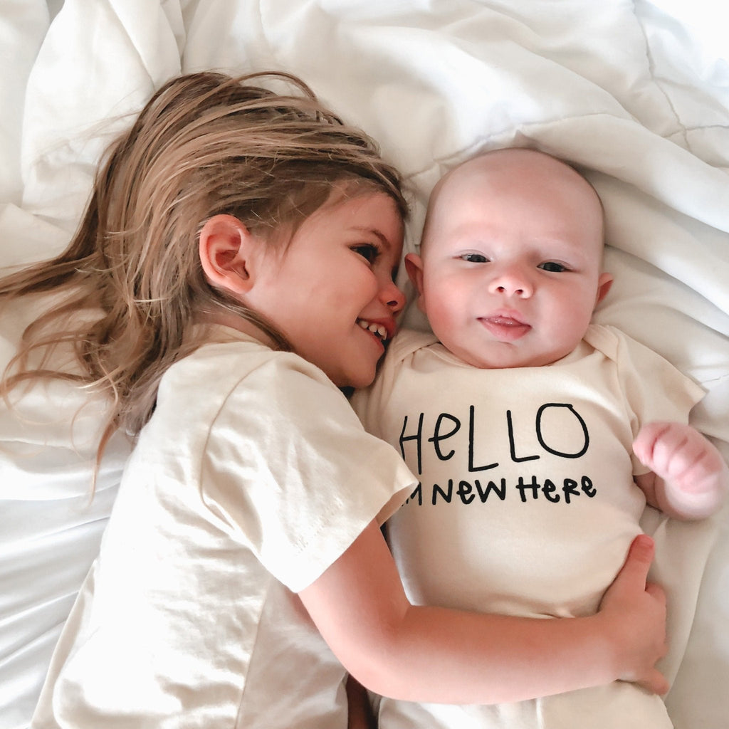 HELLO I'M NEW HERE ORGANIC BABY BODYSUIT